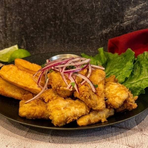 Crispy Jalea fried fish platter with yucca fries at Harlemite Peruvian restaurant Harlem